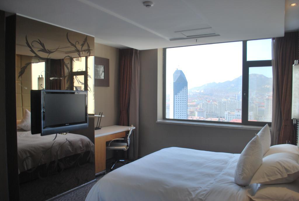 The Center Hotel Уейхай Стая снимка